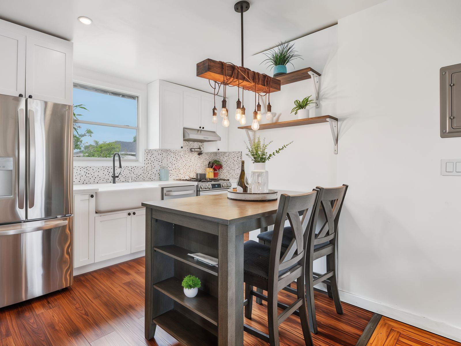 Bright white shaker kitchen remodel with farmhouse sink in Oakland by Four Piers