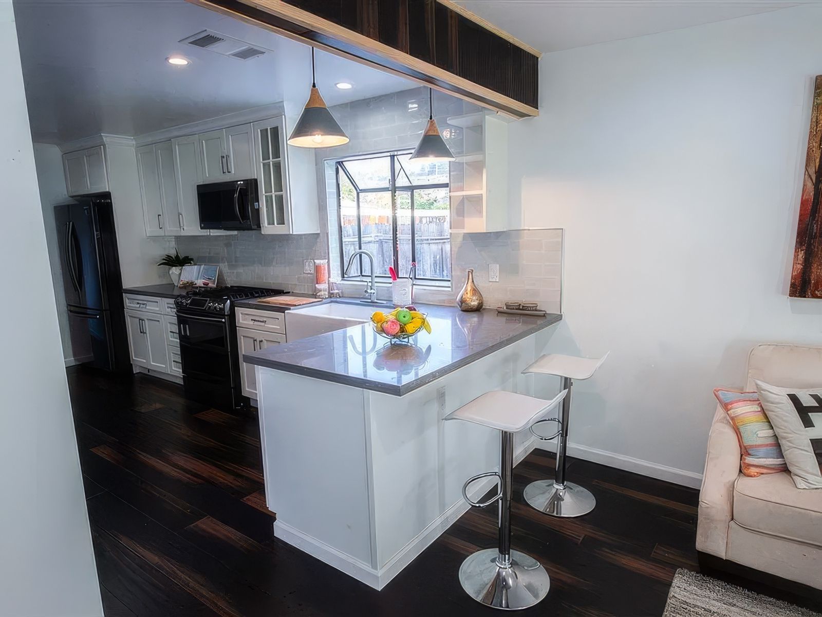 Open white kitchen remodel in San Leandro by Four Piers