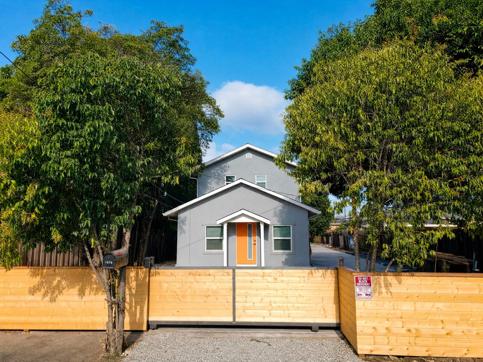 Whole-home renovation with modern gray exterior in San Leandro by Four Piers