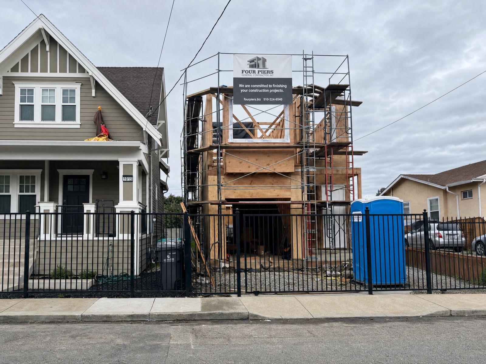Multi-story home under structural framing in Oakland by Four Piers